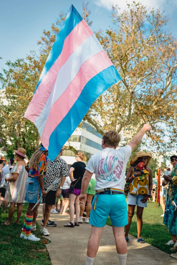 DSC07444-1352x2024 Trans Flag being held proudly at 2024 Pride